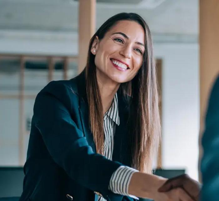 Woman and man shaking hands