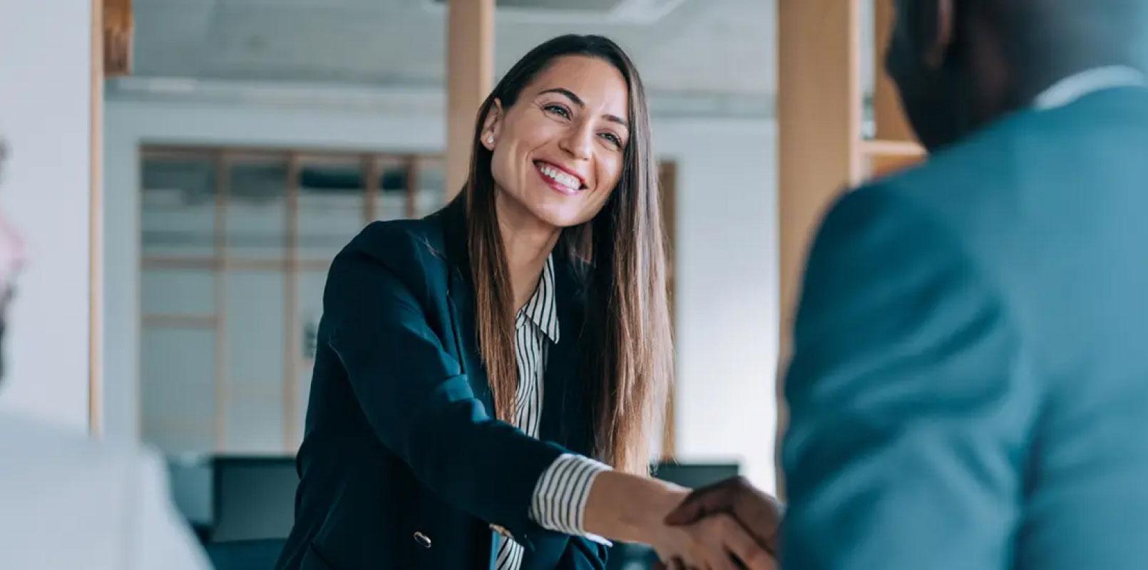 Woman and man shaking hands